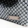 BOLSA MINI DE PERLA GRIS PERLA CON LATERAL DERECHO DE PERLA NEGRA