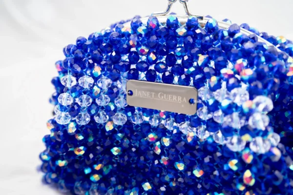 BOLSA PEQUEÑA DE CRISTALES TRANSPARENTE TORNASOL Y AZUL PAVO TORNASOL