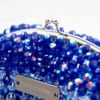 BOLSA PEQUEÑA DE CRISTALES TRANSPARENTE TORNASOL Y AZUL PAVO TORNASOL