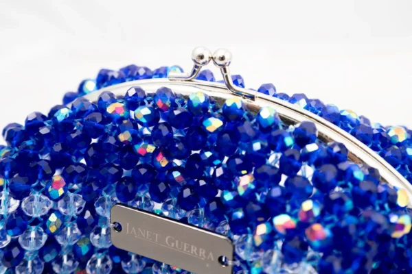 BOLSA PEQUEÑA DE CRISTALES TRANSPARENTE TORNASOL Y AZUL PAVO TORNASOL