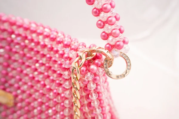 BOLSA GRANDE CON CRISTALES TRANSPARENTE TORNASOL Y PERLAS FUCSIA