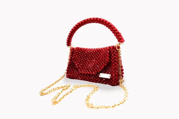 BOLSA GRANDE DE CRISTALES TIPO PERLA ROJOS Y ROJO MANCHADOS DE LINEAS BLANCAS