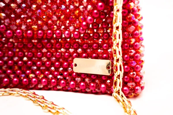 BOLSA GRANDE DE CRISTALES TIPO PERLA ROJOS Y ROJO MANCHADOS DE LINEAS BLANCAS
